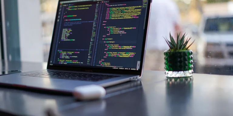 Laptop on a desk used for custom software development