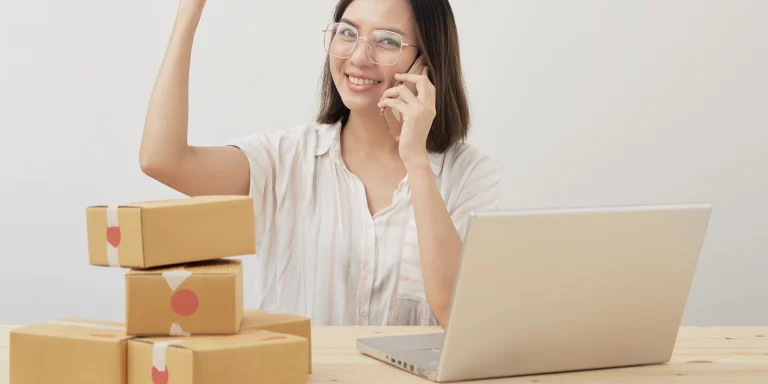 Store owner working on a laptop during an online store migration