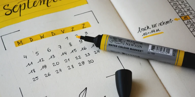 Notebook and marker for planning an Odoo implementation timeline